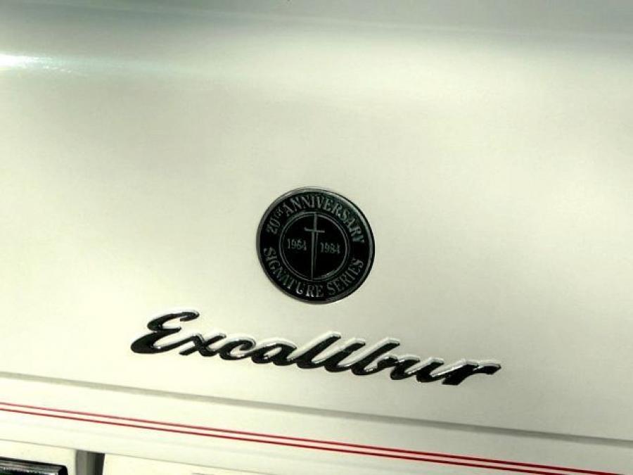 Логотип Excalibur Series IV Phaeton 20th Anniversary 1984 года  (фото 6 из 6)